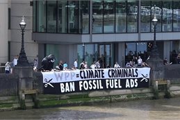 Activists at the June protest unfurled a 15-metre-long in front of the headquarters of WPP, reading "WPP are climate criminals, ban fossil fuel advertising". Activists at the June protest unfurled a 15-metre-long in front of the headquarters of WPP, reading "WPP are climate criminals, ban fossil fuel advertising".